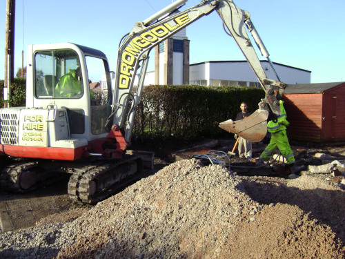 Breaking up old concrete drive surfacing.